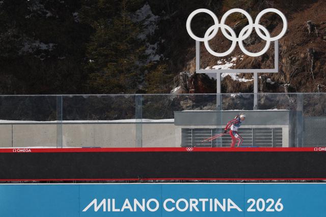 Norway's Johannes Dale-Skjevdal competes on his way towards the finish line to win gold during the men's biathlon 15km mass start event during the Milano Cortina 2026 Winter Olympic Games at the Anterselva Biathlon Arena (Sudtirol Arena) in Anterselva (Val Pusteria) on February 20, 2026. (Photo by FRANCK FIFE / AFP)