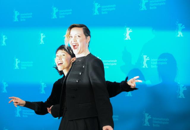 US actress Syra McCarthy and actress Eleonora Pienta (R) joke during a photo call for the film "Josephine" presented in competition at the 76th Berlinale, Europe's first major film festival of the year, in Berlin on February 20, 2026. (Photo by RALF HIRSCHBERGER / AFP)
