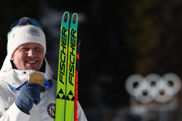 Gold medallist Norway's Johannes Dale-Skjevdal celebrates on the podium of the men's biathlon 15km mass start event during the Milano Cortina 2026 Winter Olympic Games at the Anterselva Biathlon Arena (Sudtirol Arena) in Anterselva (Val Pusteria) on February 20, 2026. (Photo by FRANCK FIFE / AFP)