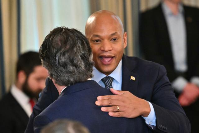 Governor of Maryland Wes Moore, (R) greets US secretary of Interior Doug Burgum as they arrive for a Working Breakfast with Governors at the White House in Washington, DC on February 20, 2026. (Photo by Mandel NGAN / AFP)
