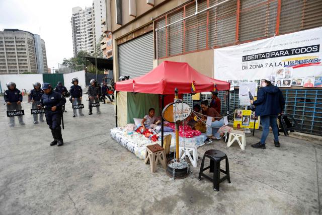 Relatives of political prisoners, who staged a nearly weeklong hunger strike that ended on the eve, remain outside the Bolivarian National Police (PNB) Zone 7 prison in Caracas on February 20, 2026. Venezuela's National Assembly on February 19 unanimously approved a long-awaited amnesty law that could free hundreds of political prisoners jailed for being government detractors. (Photo by Pedro MATTEY / AFP)