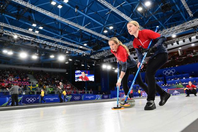 USA's Taylor Anderson-Heide and USA's Cory Thiesse compete in the curling women's round robin semi-final between USA and Switzerland during the Milano Cortina 2026 Winter Olympic Games at the Cortina Curling Olympic Stadium in Cortina d’Ampezzo on February 20, 2026. (Photo by Stefano RELLANDINI / AFP)