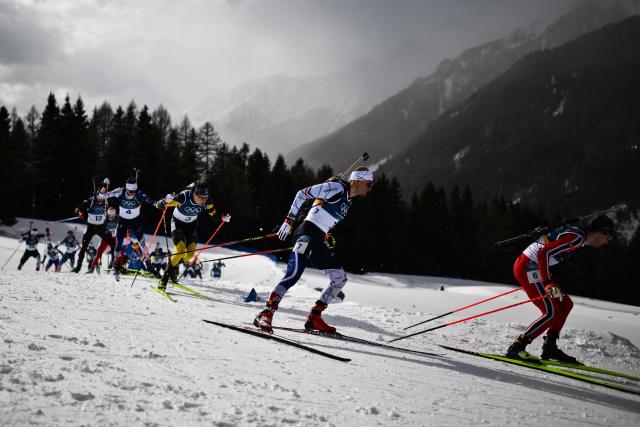 (From L) Germany's Philipp Nawrath France's Eric Perrot Sweden's Martin Ponsiluoma, France's Emilien Jacquelin and Norway's Sturla Holm Laegreid compete during the men's biathlon 15km mass start event during the Milano Cortina 2026 Winter Olympic Games at the Anterselva Biathlon Arena (Sudtirol Arena) in Anterselva (Val Pusteria) on February 20, 2026. (Photo by Marco BERTORELLO / AFP)