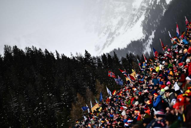 Spectators watch during the men's biathlon 15km mass start event during the Milano Cortina 2026 Winter Olympic Games at the Anterselva Biathlon Arena (Sudtirol Arena) in Anterselva (Val Pusteria) on February 20, 2026. (Photo by Marco BERTORELLO / AFP)