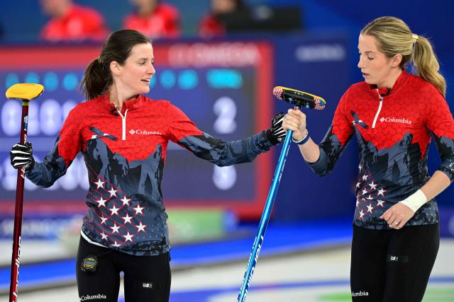 USA's Tara Peterson and USA's Taylor Anderson-Heide react after scoring a point in the curling women's round robin semi-final between USA and Switzerland during the Milano Cortina 2026 Winter Olympic Games at the Cortina Curling Olympic Stadium in Cortina d’Ampezzo on February 20, 2026. (Photo by Stefano RELLANDINI / AFP)