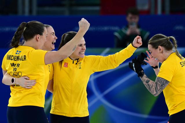 Sweden's Anna Hasselborg, Sweden's Sara McManus, Sweden's Agnes Knochenhauer and Sweden's Sofia Scharback celebrate after winning the curling women's round robin semi-final between Canada and Sweden during the Milano Cortina 2026 Winter Olympic Games at the Cortina Curling Olympic Stadium in Cortina d’Ampezzo on February 20, 2026. (Photo by Stefano RELLANDINI / AFP)