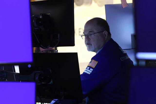 A trader works on the floor of the New York Stock Exchange (NYSE) at the opening bell in New York, on February 20, 2026. Wall Street stocks mostly fell early Friday following data showing disappointing US economic growth and an uptick in inflation. (Photo by TIMOTHY A. CLARY / AFP)
