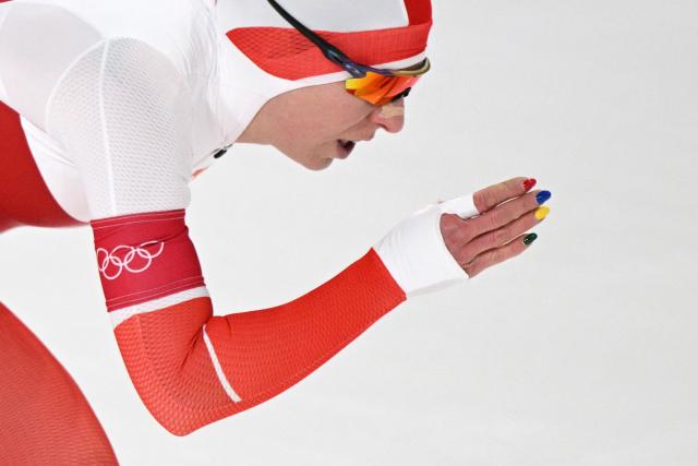 Poland's Natalia Czerwonka wears nail polish in the color of the Olympic Rings as she competes in the speed skating women's 1500m during the Milano Cortina 2026 Winter Olympic Games at Milano Speed Skating Stadium in Milan on February 20, 2026. (Photo by Daniel MUNOZ / AFP)
