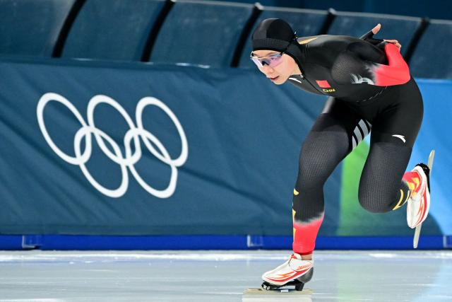 China's Yin Qi competes in the speed skating women's 1500m during the Milano Cortina 2026 Winter Olympic Games at Milano Speed Skating Stadium in Milan on February 20, 2026. (Photo by Piero CRUCIATTI / AFP)