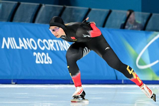 China's Yin Qi competes in the speed skating women's 1500m during the Milano Cortina 2026 Winter Olympic Games at Milano Speed Skating Stadium in Milan on February 20, 2026. (Photo by Piero CRUCIATTI / AFP)