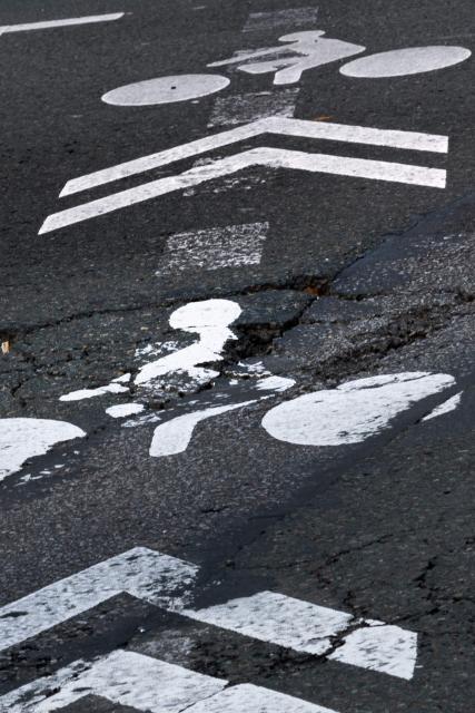 This photograph shows a pothole in the middle of a cycle path in central Paris on February 20, 2026. (Photo by JOEL SAGET / AFP)