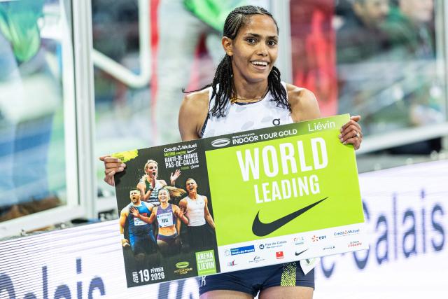 Ethiopia's Freweyni Hailu celebrates after winning in the 3000m women final at the Athletics meeting "Hauts-de-France Pas-de-Calais" as part of the World Indoor Tour Gold, in Lievin, northern France on February 19, 2026. (Photo by Sameer Al-DOUMY / AFP)