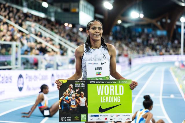 Ethiopia's Freweyni Hailu celebrates after winning in the 3000m women final at the Athletics meeting "Hauts-de-France Pas-de-Calais" as part of the World Indoor Tour Gold, in Lievin, northern France on February 19, 2026. (Photo by Sameer Al-DOUMY / AFP)