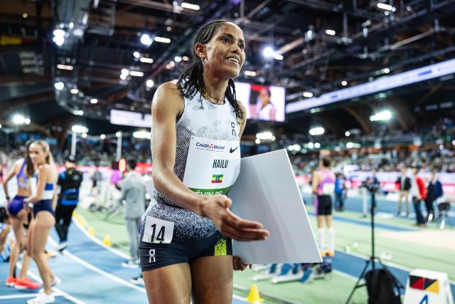Ethiopia's Freweyni Hailu celebrates after winning in the 3000m women final at the Athletics meeting "Hauts-de-France Pas-de-Calais" as part of the World Indoor Tour Gold, in Lievin, northern France on February 19, 2026. (Photo by Sameer Al-DOUMY / AFP)