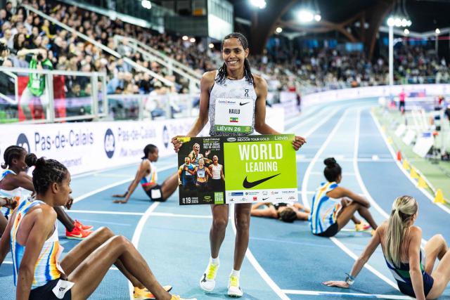 Ethiopia's Freweyni Hailu celebrates after winning in the 3000m women final at the Athletics meeting "Hauts-de-France Pas-de-Calais" as part of the World Indoor Tour Gold, in Lievin, northern France on February 19, 2026. (Photo by Sameer Al-DOUMY / AFP)