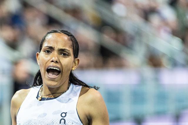Ethiopia's Freweyni Hailu competes and wins in the 3000m women final at the Athletics meeting "Hauts-de-France Pas-de-Calais" as part of the World Indoor Tour Gold, in Lievin, northern France on February 19, 2026. (Photo by Sameer Al-DOUMY / AFP)