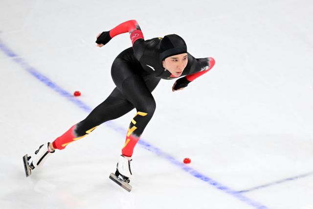 China's Han Mei competes in the speed skating women's 1500m during the Milano Cortina 2026 Winter Olympic Games at Milano Speed Skating Stadium in Milan on February 20, 2026. (Photo by Daniel MUNOZ / AFP)