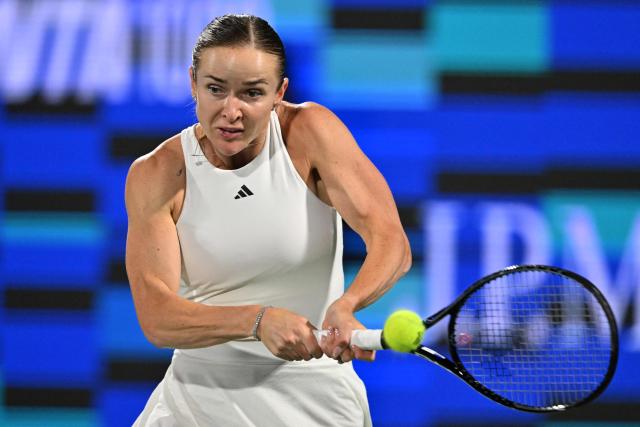 Ukraine's Elina Svitolina hits a return against US' Coco Gauff during their women’s singles semi-final match at the Dubai Duty Free Tennis tournament in Dubai on February 20, 2026. (Photo by Ryan Lim / AFP)