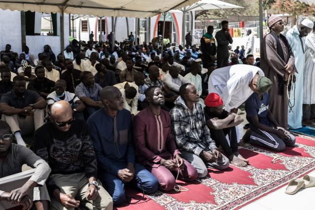 Muslims gather ahead of the first Friday prayer of the holy month of Ramadan at the Mosque of the Divinity in Dakar, on February 20, 2026. (Photo by PATRICK MEINHARDT / AFP)