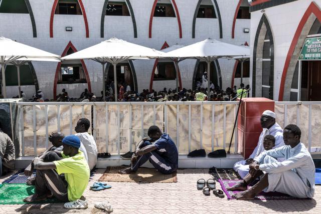 Muslims gather ahead of the first Friday prayer of the holy month of Ramadan at the Mosque of the Divinity in Dakar, on February 20, 2026. (Photo by PATRICK MEINHARDT / AFP)