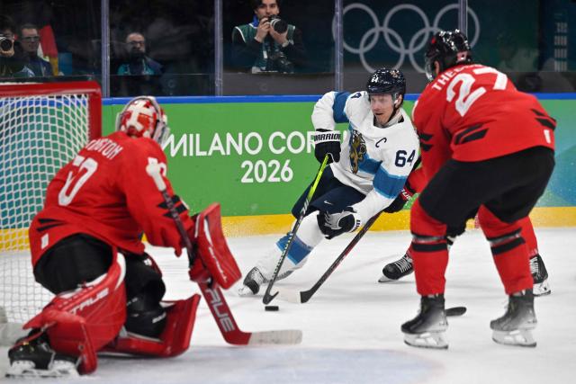 Finland's #64 Mikael Granlund (C) makes an attempt on goal during the men's play-off semi-final ice hockey match between Canada and Finland at the Milano Santagiulia Ice Hockey Arena during the Milano Cortina 2026 Winter Olympic Games in Milan, on February 20, 2026. (Photo by Alexander NEMENOV / AFP)