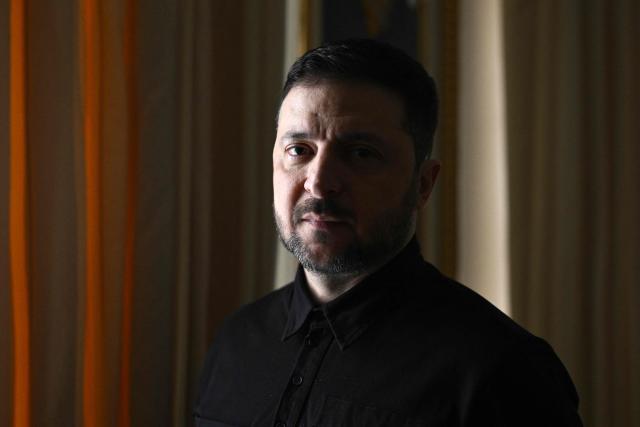 Ukraine's President Volodymyr Zelensky poses during a photo session on the sidelines of an interview with AFP journalists in Kyiv on February 20, 2026, amid the Russian invasion of Ukraine. AFP has conducted an exclusive interview with Zelensky who spoke at length, as Ukraine prepares to enter its fifth year of war. (Photo by Genya SAVILOV / AFP)