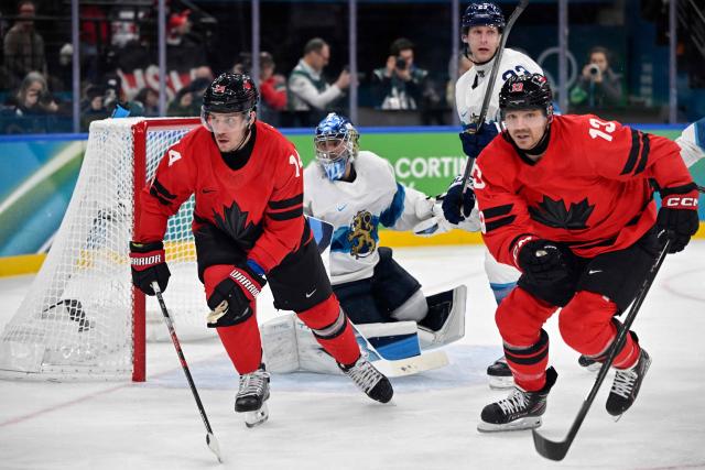 Canada's #14 Bo Horvat (L) and Canada's #13 Sam Reinhart react during the men's play-off semi-final ice hockey match between Canada and Finland at the Milano Santagiulia Ice Hockey Arena during the Milano Cortina 2026 Winter Olympic Games in Milan, on February 20, 2026. (Photo by Alexander NEMENOV / AFP)