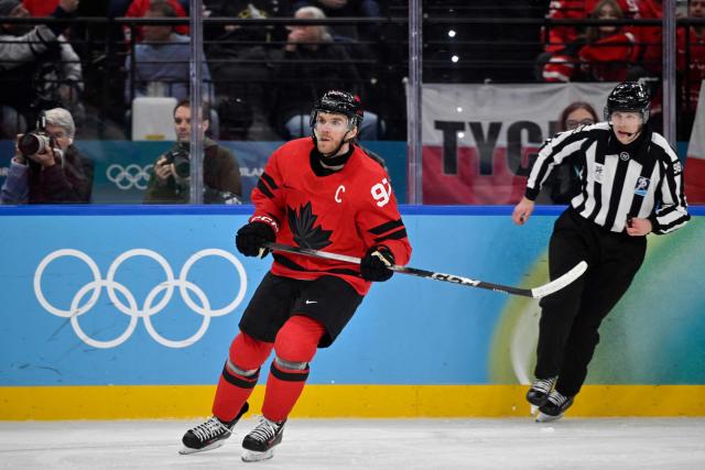 Canada's #97 Connor McDavid reacts during the men's play-off semi-final ice hockey match between Canada and Finland at the Milano Santagiulia Ice Hockey Arena during the Milano Cortina 2026 Winter Olympic Games in Milan, on February 20, 2026. (Photo by Alexander NEMENOV / AFP)