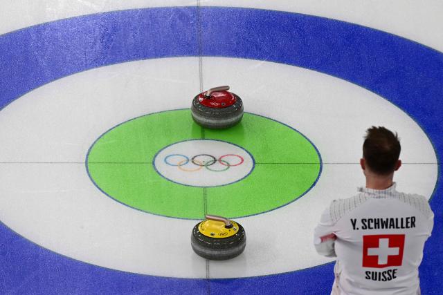 Switzerland's Yannick Schwaller watches the curling stones in the curling men's round robin bronze medal game between Norway and Switzerland during the Milano Cortina 2026 Winter Olympic Games at the Cortina Curling Olympic Stadium in Cortina d’Ampezzo on February 20, 2026. (Photo by Stefano RELLANDINI / AFP)