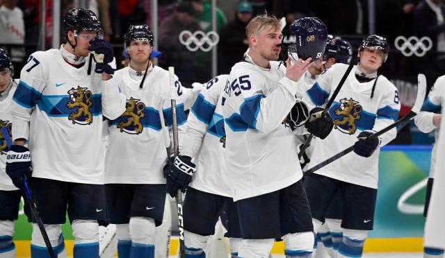 Finland's players react at the end of the men's play-off semi-final ice hockey match between Canada and Finland at the Milano Santagiulia Ice Hockey Arena during the Milano Cortina 2026 Winter Olympic Games in Milan, on February 20, 2026. Canada won the match 3-2. (Photo by Alexander NEMENOV / AFP)