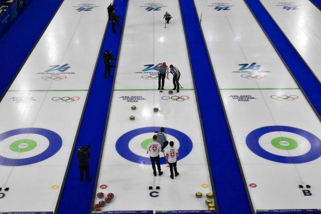 A general view of Switzerland's and Norway's players during the curling men's round robin bronze medal game between Norway and Switzerland during the Milano Cortina 2026 Winter Olympic Games at the Cortina Curling Olympic Stadium in Cortina d’Ampezzo on February 20, 2026. (Photo by Stefano RELLANDINI / AFP)