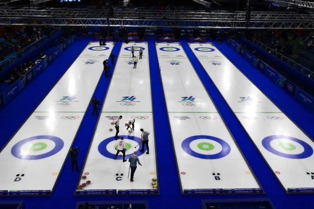 A general view of Switzerland's and Norway's players during the curling men's round robin bronze medal game between Norway and Switzerland during the Milano Cortina 2026 Winter Olympic Games at the Cortina Curling Olympic Stadium in Cortina d’Ampezzo on February 20, 2026. (Photo by Stefano RELLANDINI / AFP)