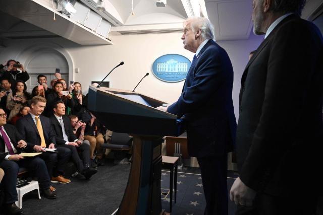 US President Donald Trump and US Secretary of Commerce Howard Lutnick, speaks during a press conference in the Brady Press Briefing Room of the White House in Washington, DC, on February 20, 2026. US President Donald Trump will hold a press conference Friday to discuss the Supreme Court's ruling against a major part of his tariffs, spokeswoman Karoline Leavitt said. (Photo by Mandel NGAN / AFP)