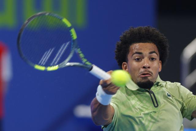 France's Arthur Fils hits a return against Czech Republic’s Jakub Mensik during their men’s singles semi-final match at the Qatar Open tennis tournament in Doha on February 20, 2026. (Photo by Karim JAAFAR / AFP)