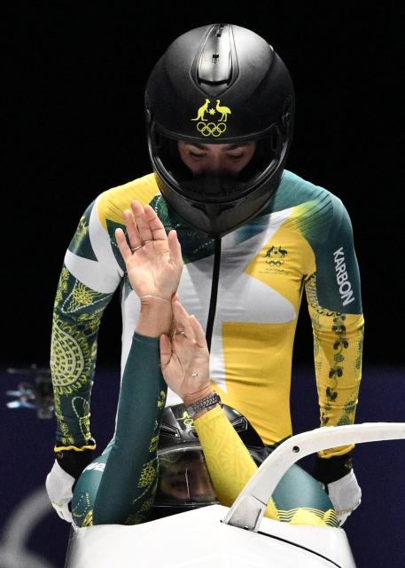 Australia's Bree Walker and Australia's Kiara Reddingius compete in the women's bobsleigh 2-woman heat 2 at Cortina Sliding Centre during the Milano Cortina 2026 Winter Olympic Games in Cortina d'Ampezzo on February 20, 2026. (Photo by Tiziana FABI / AFP)