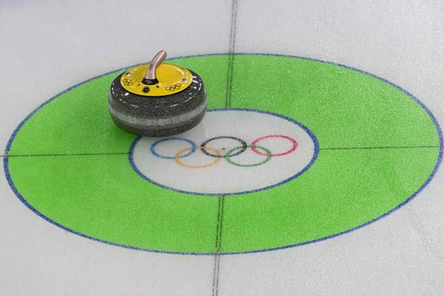 A general view of a curling stone during the curling men's round robin bronze medal game between Norway and Switzerland during the Milano Cortina 2026 Winter Olympic Games at the Cortina Curling Olympic Stadium in Cortina d’Ampezzo on February 20, 2026. (Photo by Stefano RELLANDINI / AFP)