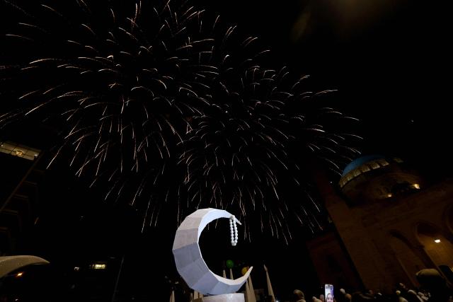 Fireworks illuminate the sky in celebration of the start of the holy Muslim month of Ramadan in downtown Beirut on February 20, 2026. Muslims throughout the world are marking the month of Ramadan, the holiest month in the Islamic calendar, during which devotees fast from dawn until dusk. (Photo by Anwar AMRO / AFP)
