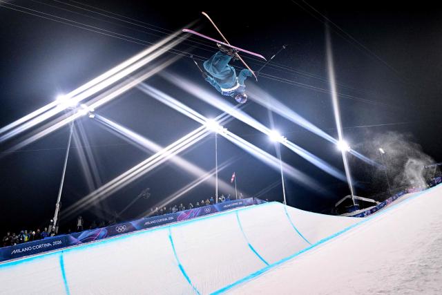 Estonia's Henry Sildaru competes in the freestyle skiing men's freeski halfpipe final run 3 during the Milano Cortina 2026 Winter Olympic Games at Livigno Snow Park, in Livigno (Valtellina), on February 20, 2026. (Photo by Kirill KUDRYAVTSEV / AFP)