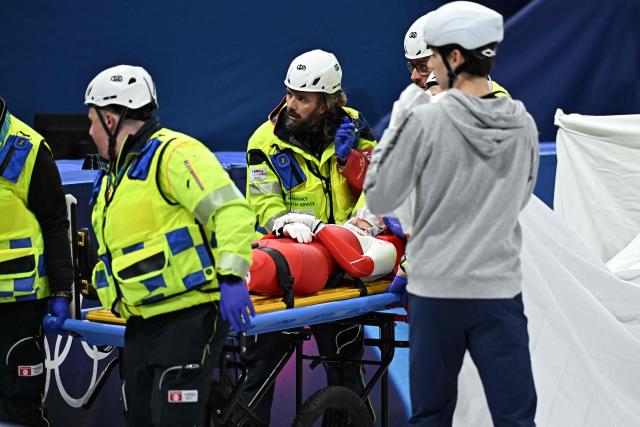 Poland's Kamila Sellier is taken away on stretcher after crashing during the short track speed skating women's 1500m quarter-final during the Milano Cortina 2026 Winter Olympic Games at Milano Ice Skating Arena in Milan on February 20, 2026. (Photo by Gabriel BOUYS / AFP)