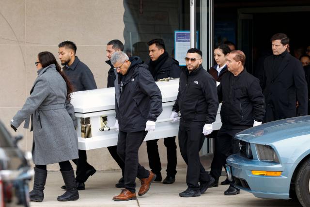 Pallbearers carry the casket of Ofelia Torres from William Parish after her funeral Mass in Chicago, Illinois on February 20 2026. Torres gained attention in October 2025 when she posted an Instagram video calling for the release of her father, Ruben Torres Maldonado, from ICE detention while raising awareness about other families in a similar situation. Torres died from a rare form of cancer on February 13. (Photo by KAMIL KRZACZYNSKI / AFP)