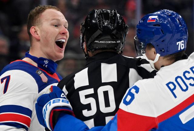 Officials intervene as USA's #07 Brady Tkachuk (L) and Slovakia's #76 Martin Pospisil have an altercation during the men's play-off semi-final ice hockey match between USA and Slovakia at the Milano Santagiulia Ice Hockey Arena during the Milano Cortina 2026 Winter Olympic Games in Milan, on February 20, 2026. (Photo by Alexander NEMENOV / AFP)