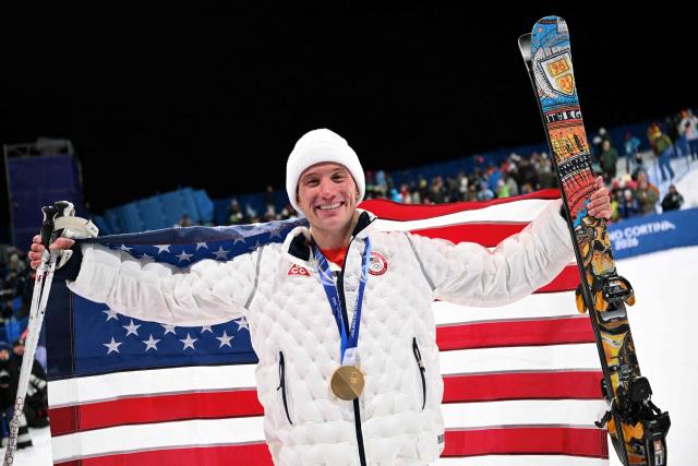 Gold medallist USA's Alex Ferreira poses with the US flag after the freestyle skiing men's freeski halfpipe final during the Milano Cortina 2026 Winter Olympic Games at Livigno Snow Park, in Livigno (Valtellina), on February 20, 2026. (Photo by Kirill KUDRYAVTSEV / AFP)