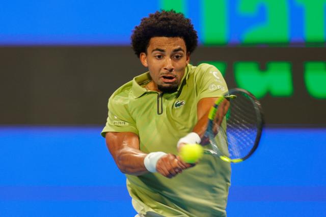 France's Arthur Fils hits a return against Czech Republic’s Jakub Mensik during their men’s singles semi-final match at the Qatar Open tennis tournament in Doha on February 20, 2026. (Photo by Karim JAAFAR / AFP)