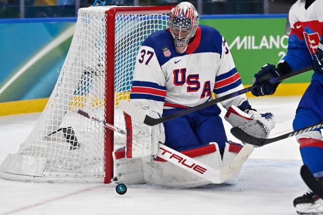 USA's #37 Connor Hellebuyck watches the puck moving past the goal during the men's play-off semi-final ice hockey match between USA and Slovakia at the Milano Santagiulia Ice Hockey Arena during the Milano Cortina 2026 Winter Olympic Games in Milan, on February 20, 2026. (Photo by Alexander NEMENOV / AFP)