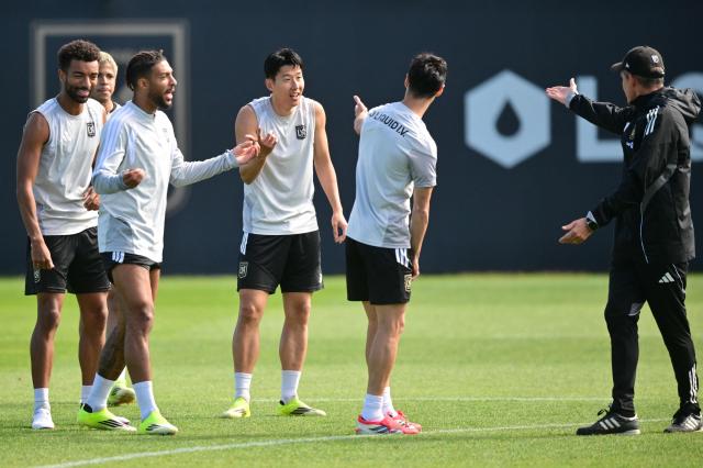 Los Angeles Football Club's South Korean player Son Heung-Min (center L) speaks with teammates during a training session at The Liquid I.V. Performance Center on the campus of Cal State LA in Los Angeles on February 20, 2026. (Photo by Frederic J. Brown / AFP)