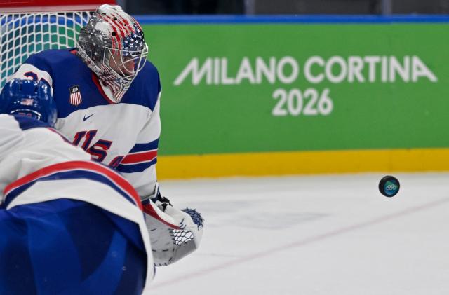 USA's #37 Connor Hellebuyck eyes the puck during the men's play-off semi-final ice hockey match between USA and Slovakia at the Milano Santagiulia Ice Hockey Arena during the Milano Cortina 2026 Winter Olympic Games in Milan, on February 20, 2026. (Photo by Alexander NEMENOV / AFP)