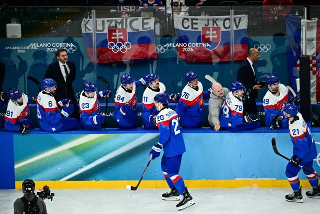 Slovakia's #20 Juraj Slafkovsky celebrates after scoring their first goal during the men's play-off semi-final ice hockey match between USA and Slovakia at the Milano Santagiulia Ice Hockey Arena during the Milano Cortina 2026 Winter Olympic Games in Milan, on February 20, 2026. (Photo by JULIEN DE ROSA / AFP)