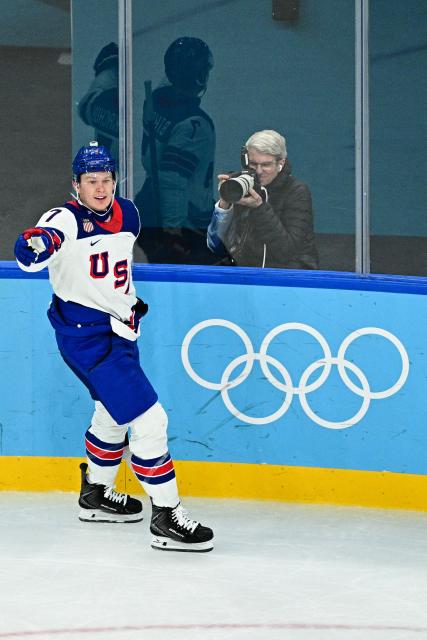 USA's #07 Brady Tkachuk reacts after scoring the 6-1 goal during the men's play-off semi-final ice hockey match between USA and Slovakia at the Milano Santagiulia Ice Hockey Arena during the Milano Cortina 2026 Winter Olympic Games in Milan, on February 20, 2026. (Photo by JULIEN DE ROSA / AFP)