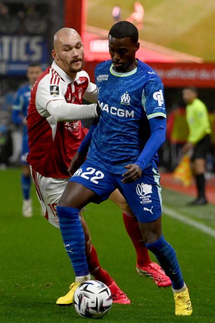 Brest's French forward #19 Ludovic Ajorque (L) fights for the ball with Marseille's US forward #22 Timothy Weah during the French L1 football match between Stade Brestois 29 and Olympique de Marseille at Francis-Le Ble stadium in Brest on February 20, 2026. (Photo by JEAN-FRANCOIS MONIER / AFP)