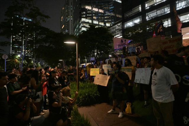 Brazilian natives from the Guarani ethnic group and environmental activists protest against dredging in the Amazon in front of the headquarters of US agribusiness giant Cargill in Sao Paulo, Brazil, on February 20, 2026. (Photo by NELSON ALMEIDA / AFP)